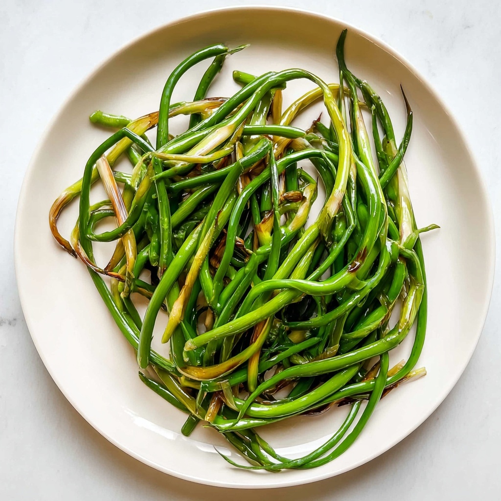 Sautéed Garlic Scapes with Soy and Rice Vinegar Recipe - Recipe Image